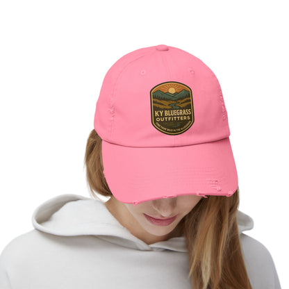 Pink cap with a logo worn by a person on a white background